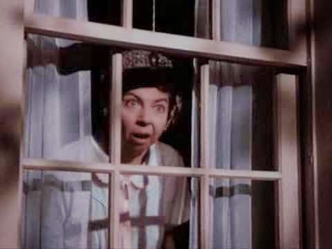 Gladys Kravitz peeking out the window