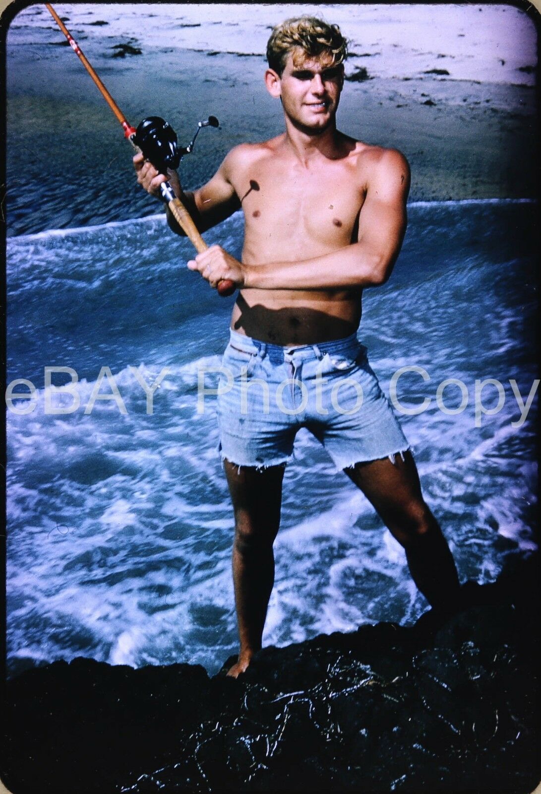 Ebay photo of Ernie Matthews holding a fishing pole