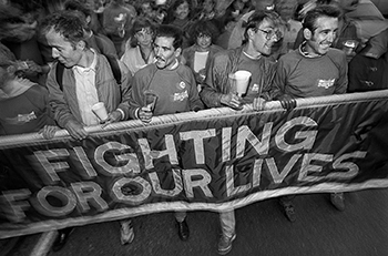 AIDS activists hodling banner that says Fighting for Our Lives