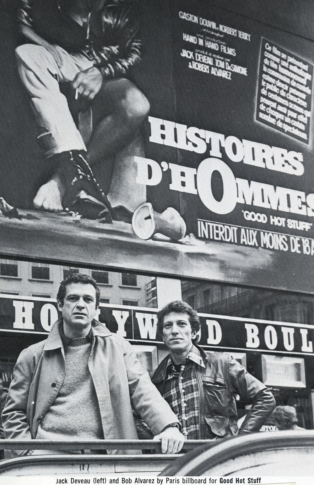 Jack and Robert Alvarez in front of a Histoires d'Hommes billboard in Paris