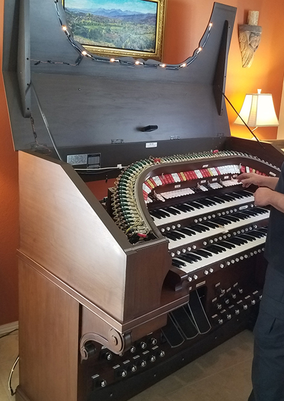 Open organ with maintenance man at work