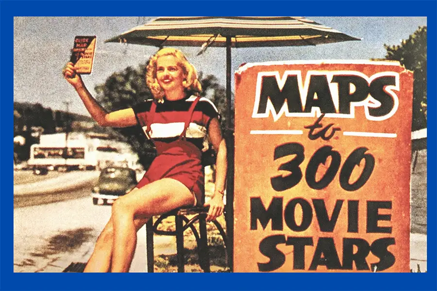 Vintage image of a young woman selling maps to stars' homes