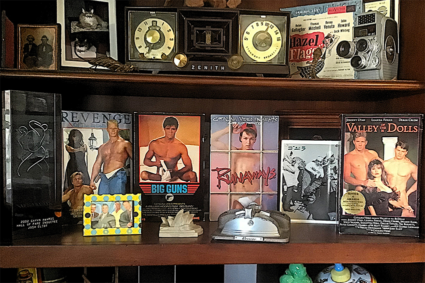 Josh's VHS collection on a shelf including Big Guns