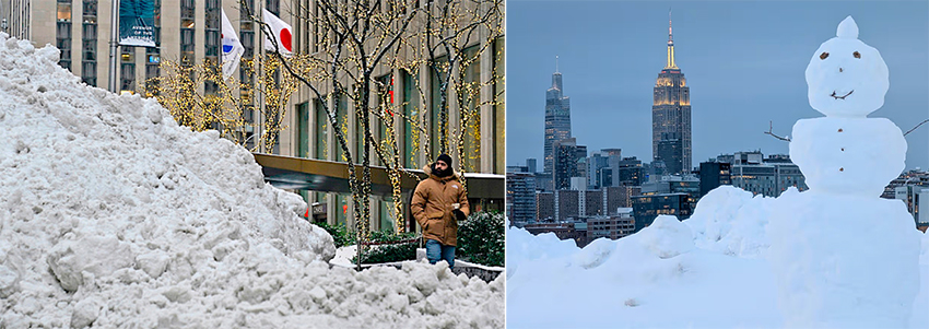 Man beside a giant snow pile and a snowman in front of the NYC skyline
