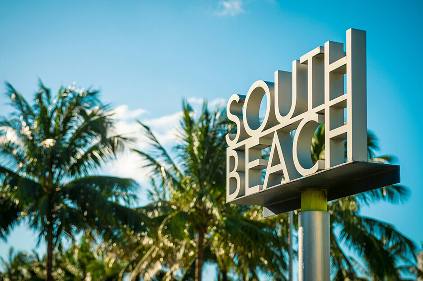 Large South Beach sign by palm trees