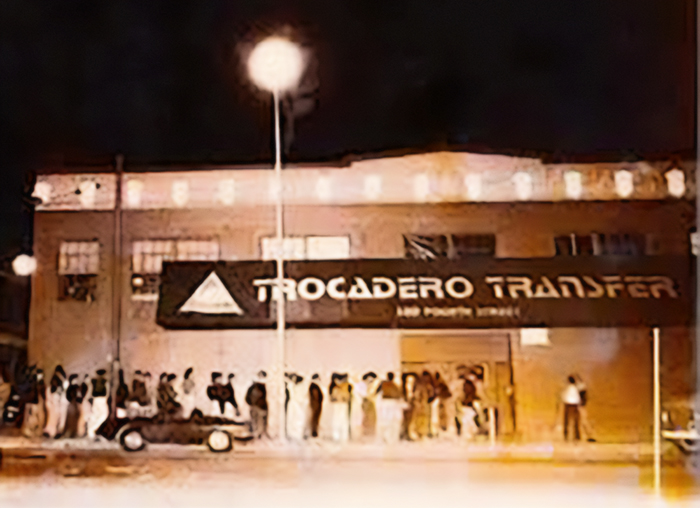 Exterior of the Trocadero Transfer with long line wrapping along the block