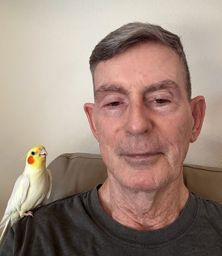 A recent photo of Will, posing with his bird perched on his shoulder